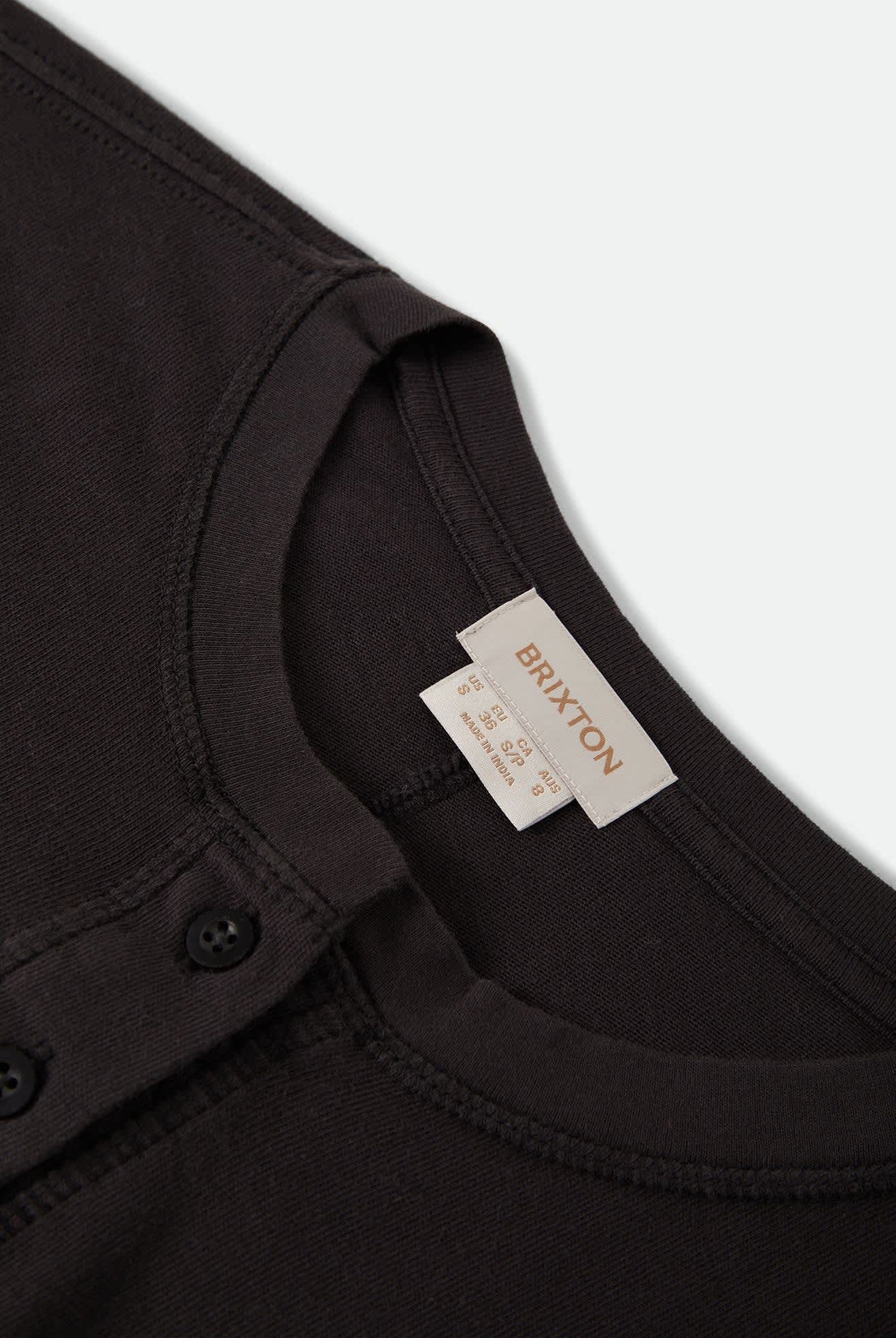 Women's Carefree Organic Garment Dye Cropped Henley in the color Black - Additional Laydown image