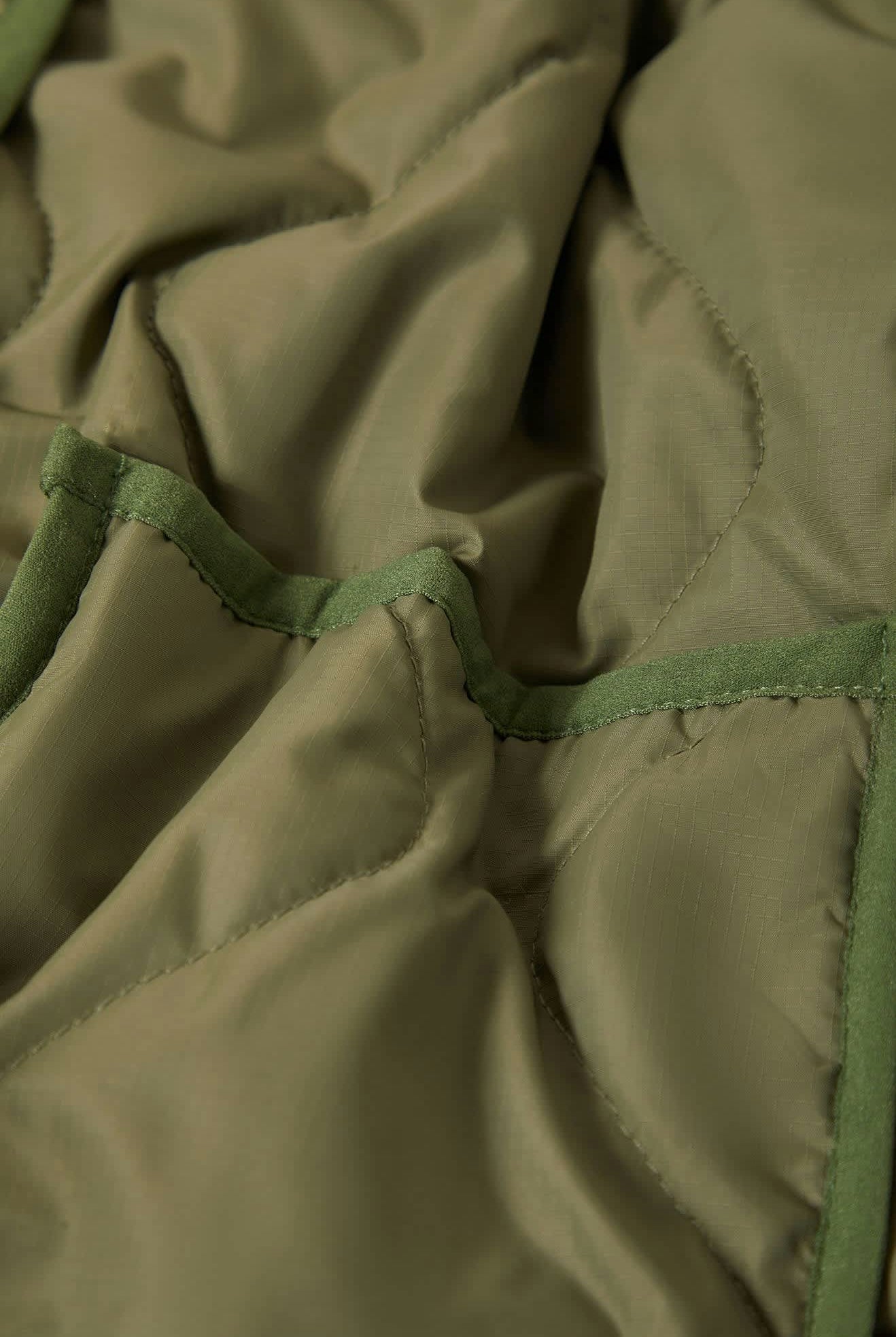 Women's Delilah Quilted Jacket in the color Olive Surplus - Additional Laydown image