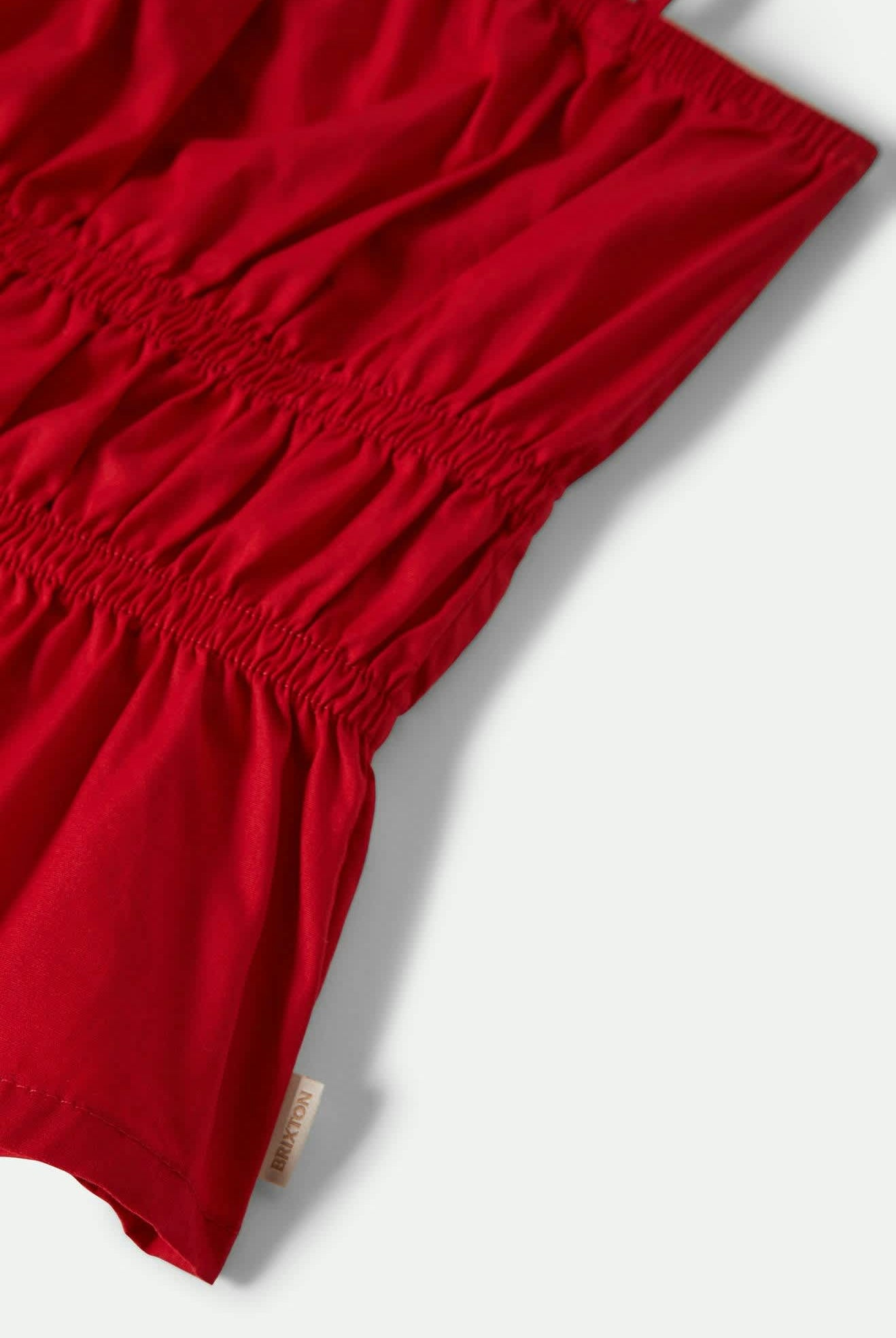 Women's Eden Smocked Top in the color Crimson - Additional Laydown image