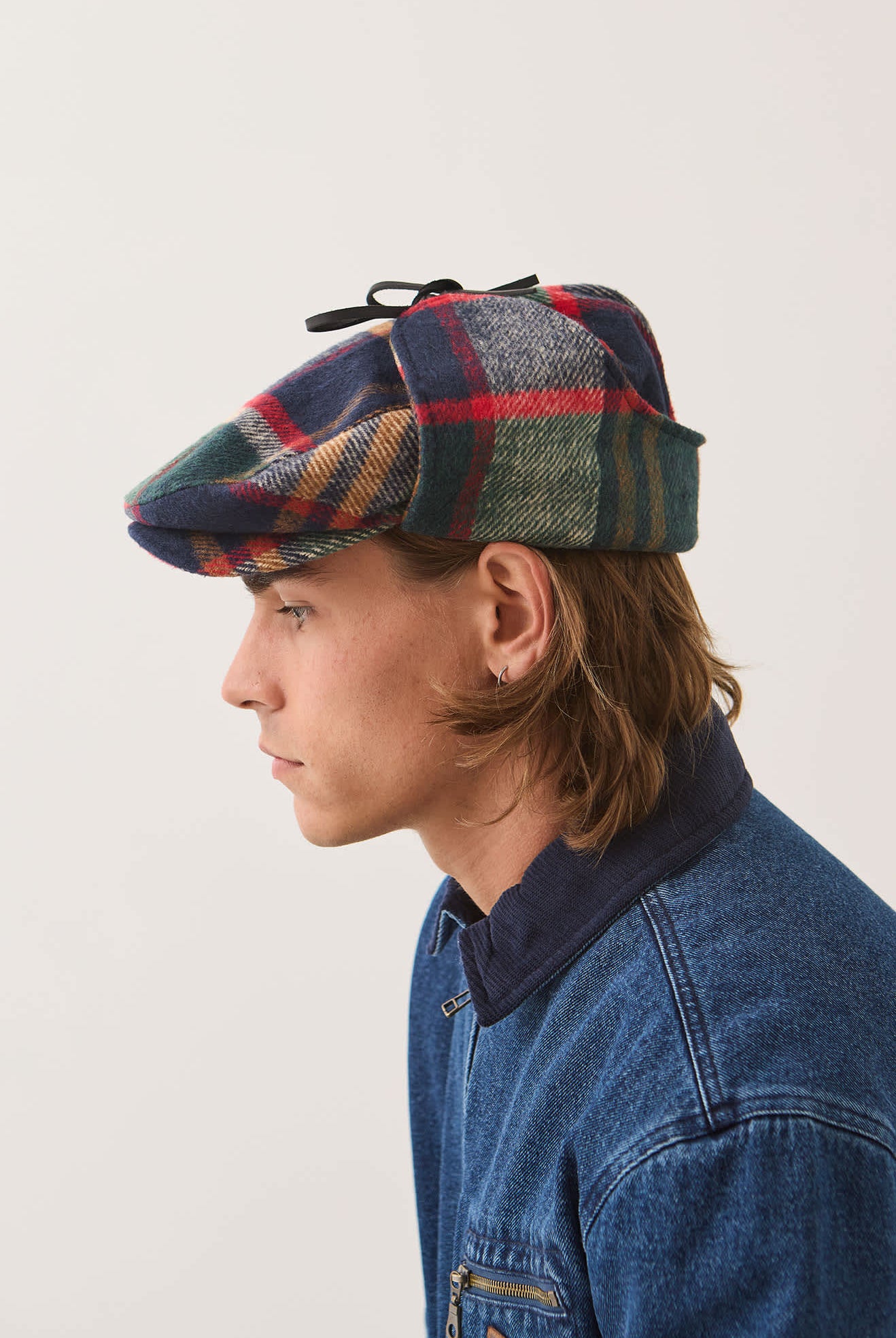 Unisex Barrel Earflap Snap Cap in the color Navy/Green/Red/Cream - Men's Side View