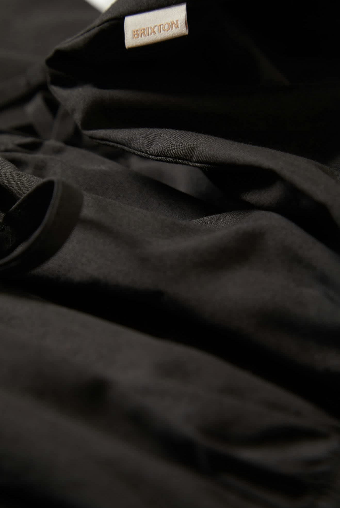 Women's Eden Smocked Jumpsuit in the color Black - Additional Laydown image