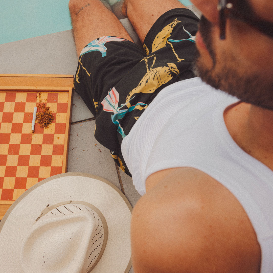 Stay cool in Men's trunks and straw headwear