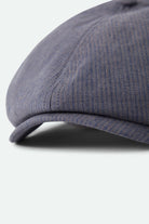 Unisex Brood Newsboy Cap in the color Indigo/Dark Sand - Additional Laydown image
