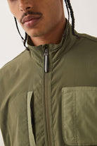 Men's Journey Utility Vest in the color Dark Olive/Olive Surplus - Men's Side View