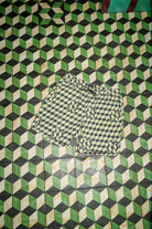 Men's Burger She Wrote Hybrid Short in the color Black/Green Tile - Additional Laydown image