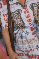 Women's The Cinch Button Down Short Sleeve Dress in the color Lost In Reality Print - Men's Lifestyle image