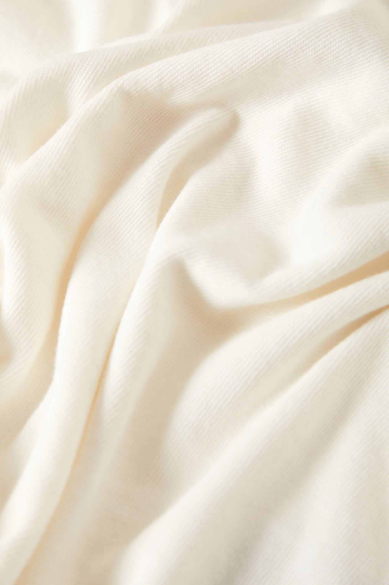 Women's Carefree Organic Garment Dye Cropped Tank in the color Off White - Additional Laydown image