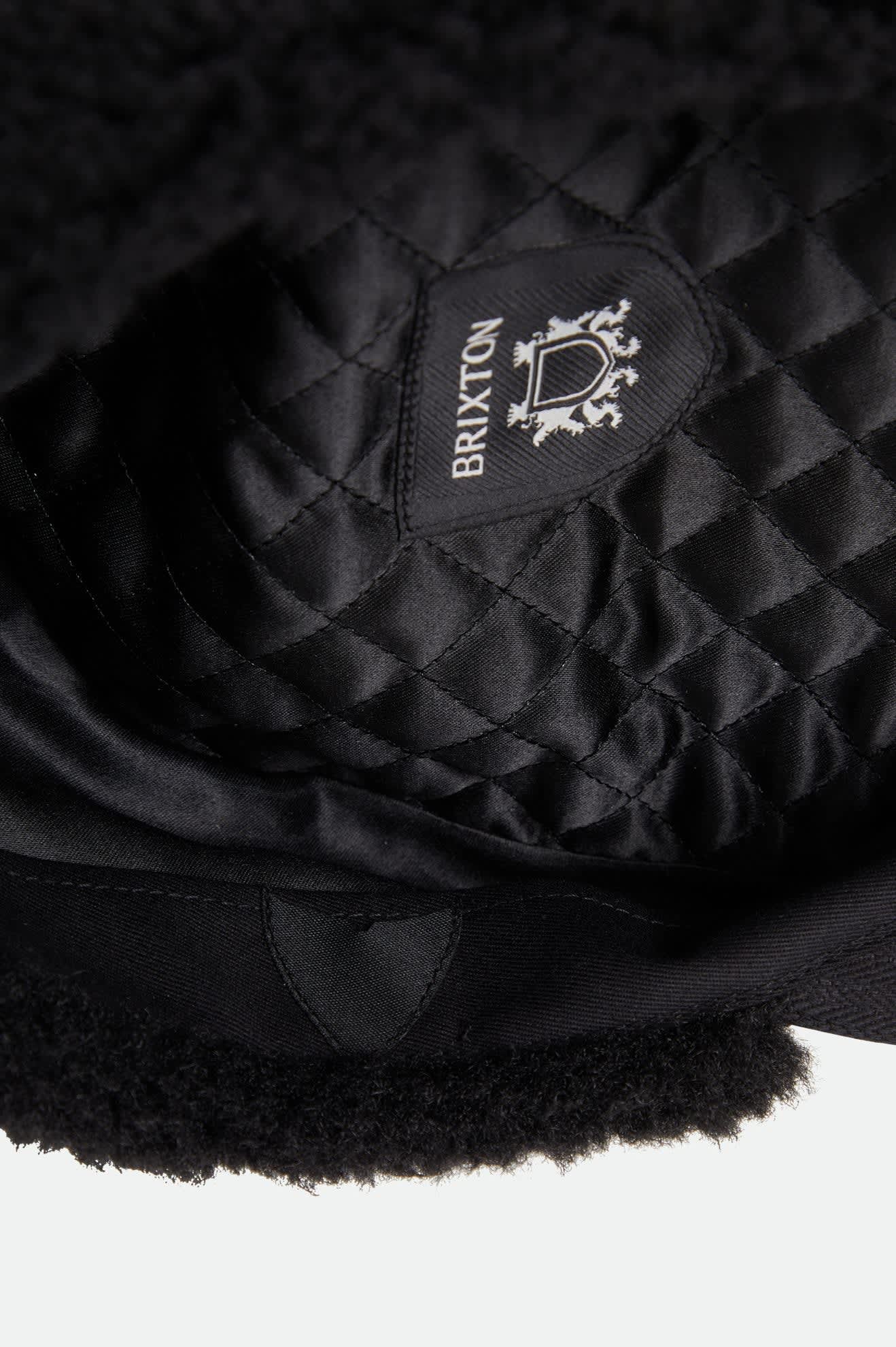 Unisex Barrel Earflap Snap Cap in the color Black/Black - Additional Laydown image